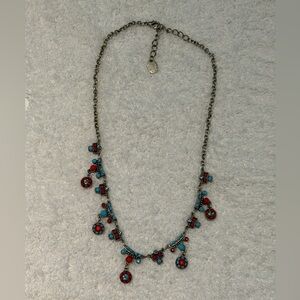 vintage-style silver-toned necklace with red and turquoise rhinestone and beads